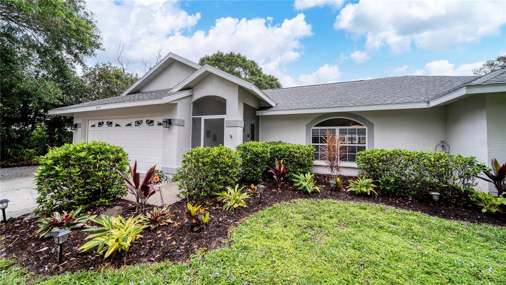 5219 Inverness Drive Sarasota, FL 34243 - Photo 1 of 32 a front view of a house with a yard