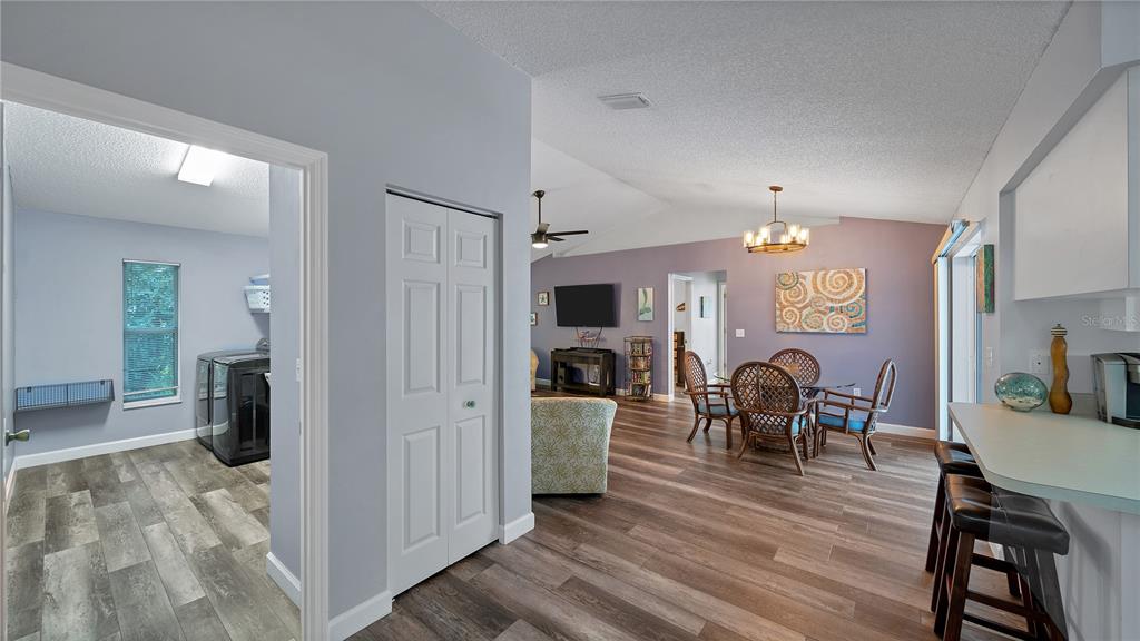 5219 Inverness Drive Sarasota, FL 34243 - Photo 21 of 32 a view of a dining room with furniture window and wooden floor