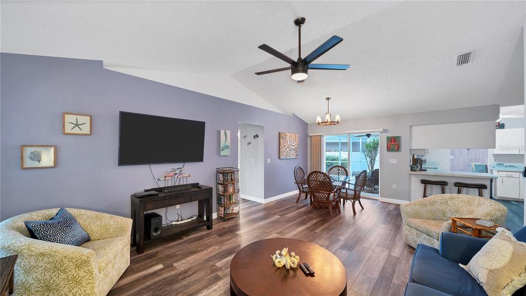 5219 Inverness Drive Sarasota, FL 34243 - Photo 22 of 32 a living room with furniture and a flat screen tv