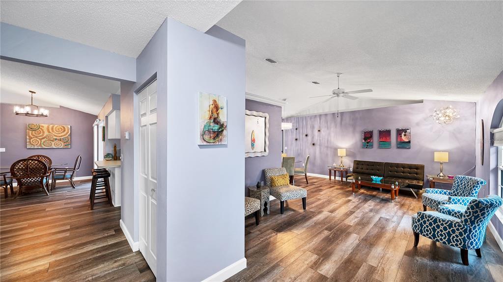 5219 Inverness Drive Sarasota, FL 34243 - Photo 24 of 32 a living room with furniture and a wooden floor