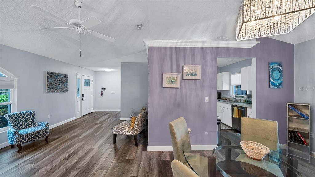 5219 Inverness Drive Sarasota, FL 34243 - Photo 27 of 32 a living room with furniture and wooden floor