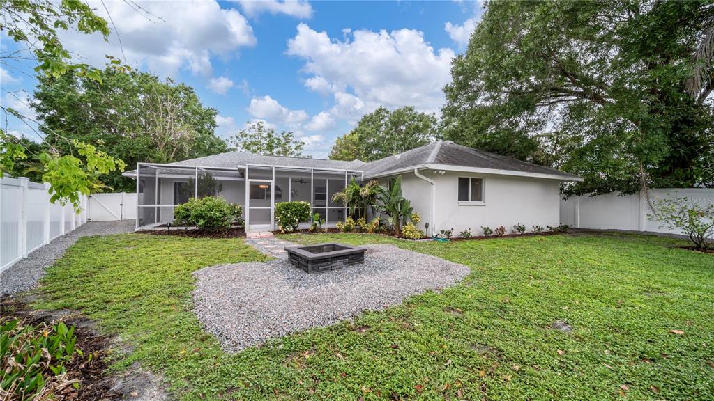 5219 Inverness Drive Sarasota, FL 34243 - Photo 28 of 32 a view of a house with backyard and sitting area