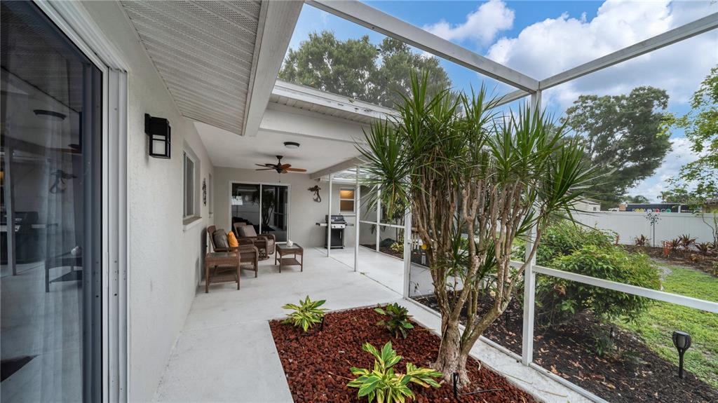 5219 Inverness Drive Sarasota, FL 34243 - Photo 29 of 32 a view of a patio with table and chairs and potted plants