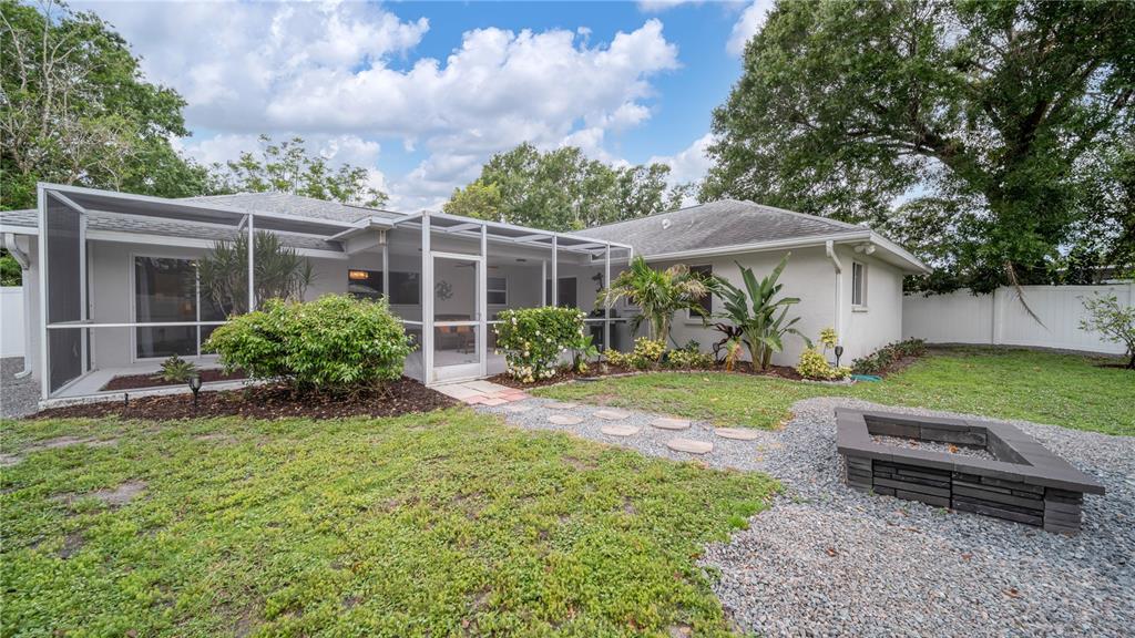 5219 Inverness Drive Sarasota, FL 34243 - Photo 32 of 32 a view of a house with backyard and a garden