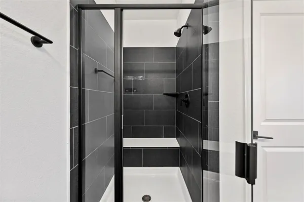 a bathroom with a double vanity sink and mirror