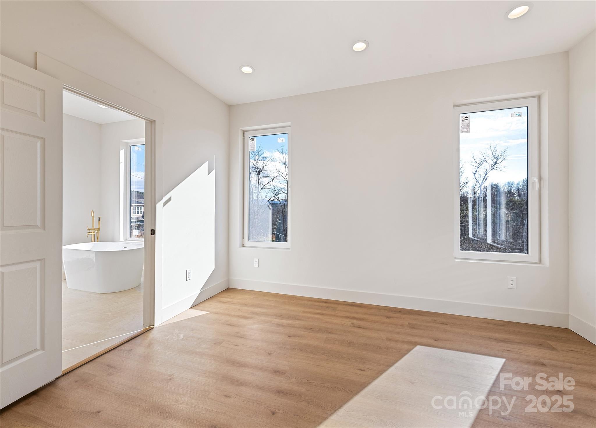 40 Firefly Ridge Trail Alexander, NC 28701 - Photo 15 of 33 wooden floor in an empty room with a window