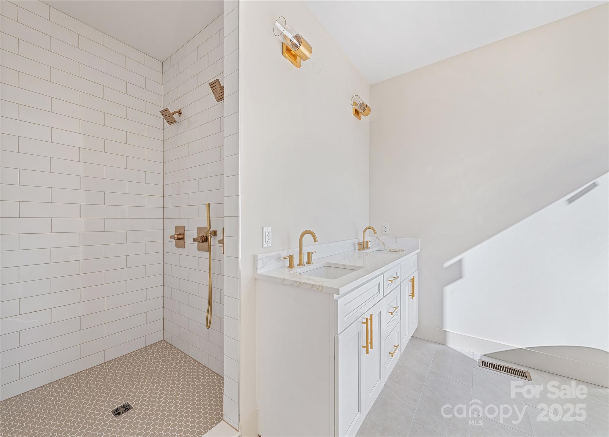 40 Firefly Ridge Trail Alexander, NC 28701 - Photo 16 of 33 a bathroom with a sink a mirror and shower
