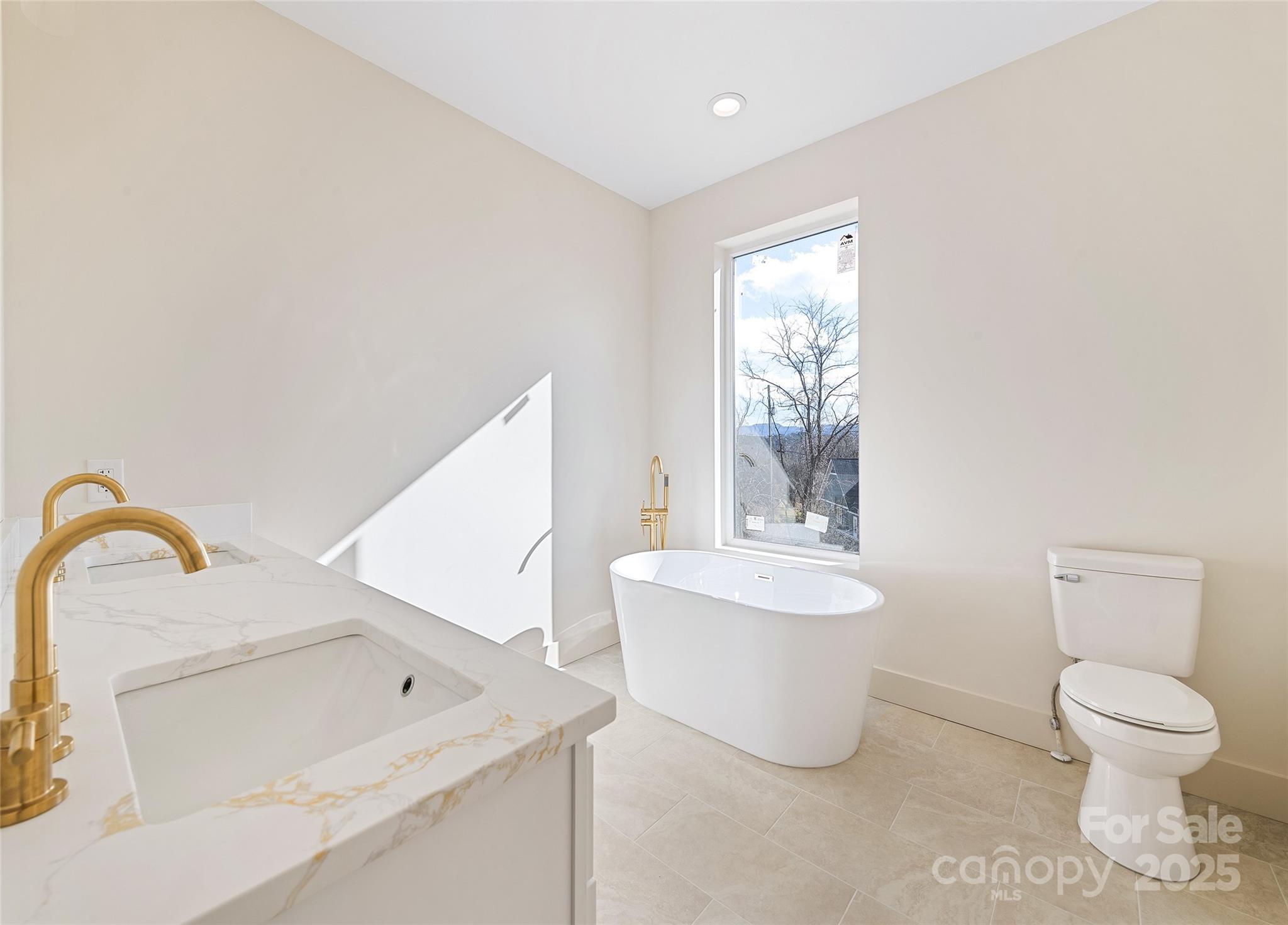 40 Firefly Ridge Trail Alexander, NC 28701 - Photo 17 of 33 a bathroom with a toilet sink and mirror