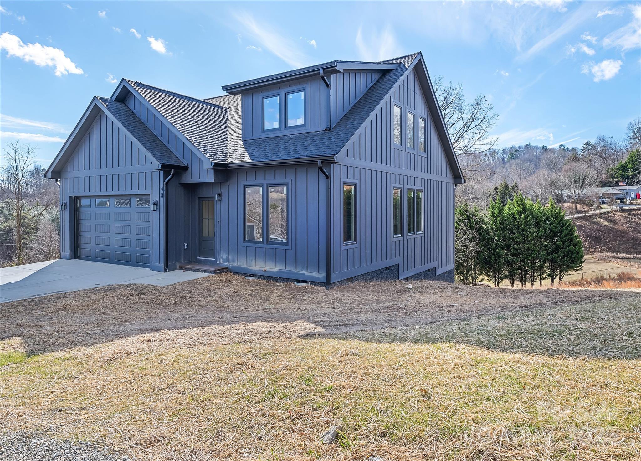 40 Firefly Ridge Trail Alexander, NC 28701 - Photo 2 of 33 a front view of a house with a yard