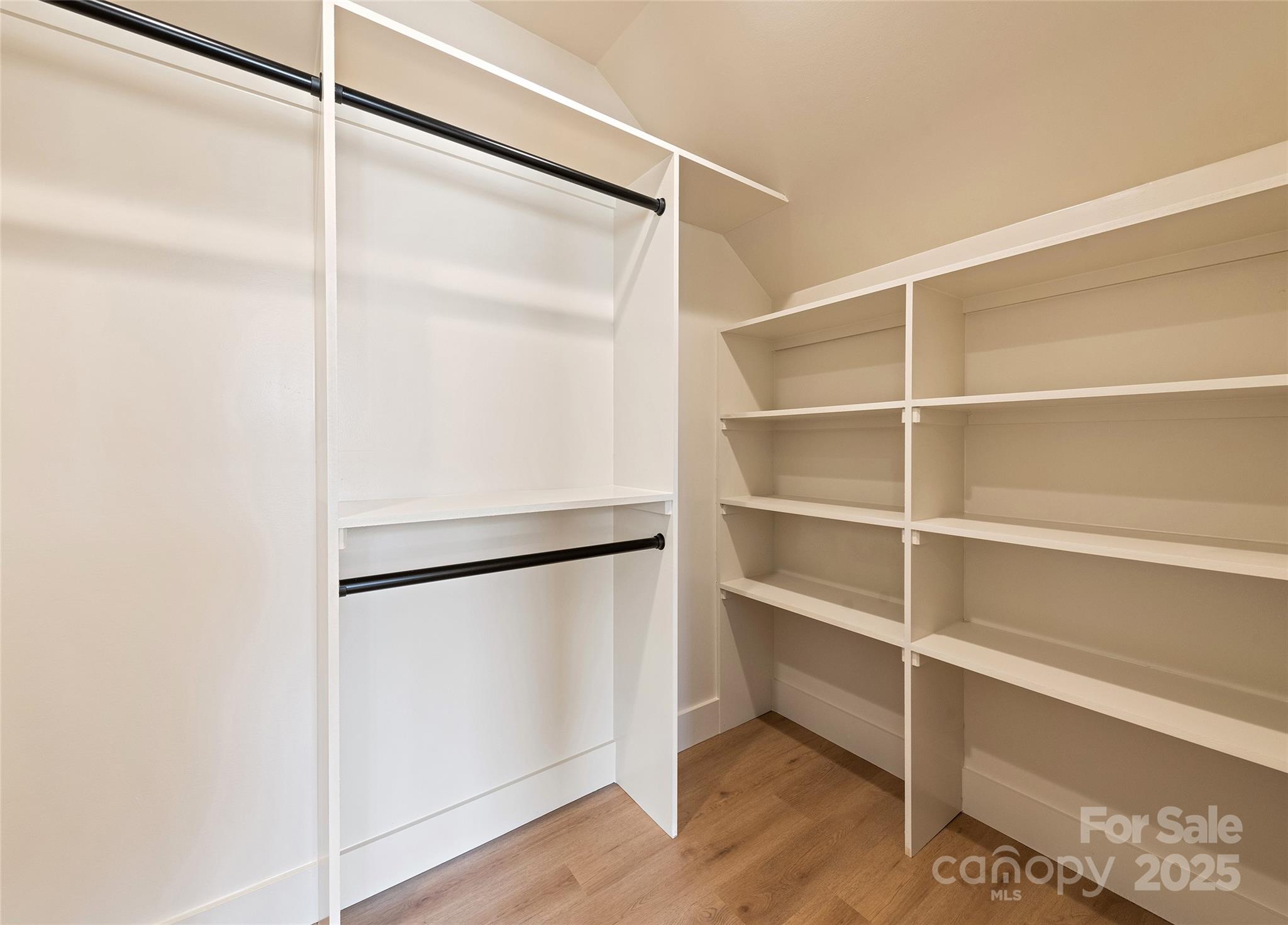 40 Firefly Ridge Trail Alexander, NC 28701 - Photo 23 of 33 a view of a walk in closet with empty racks