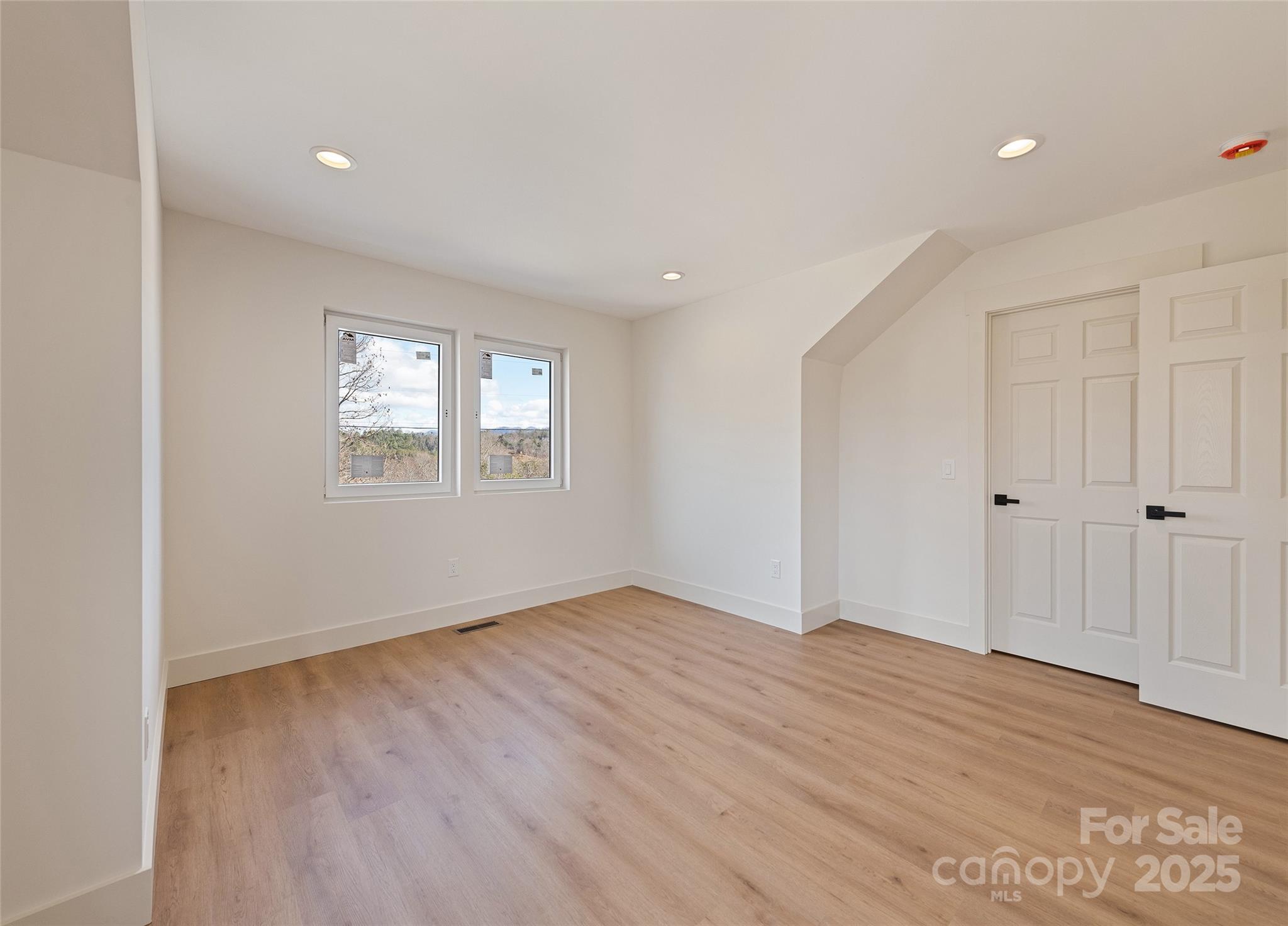40 Firefly Ridge Trail Alexander, NC 28701 - Photo 25 of 33 wooden floor in an empty room with a window