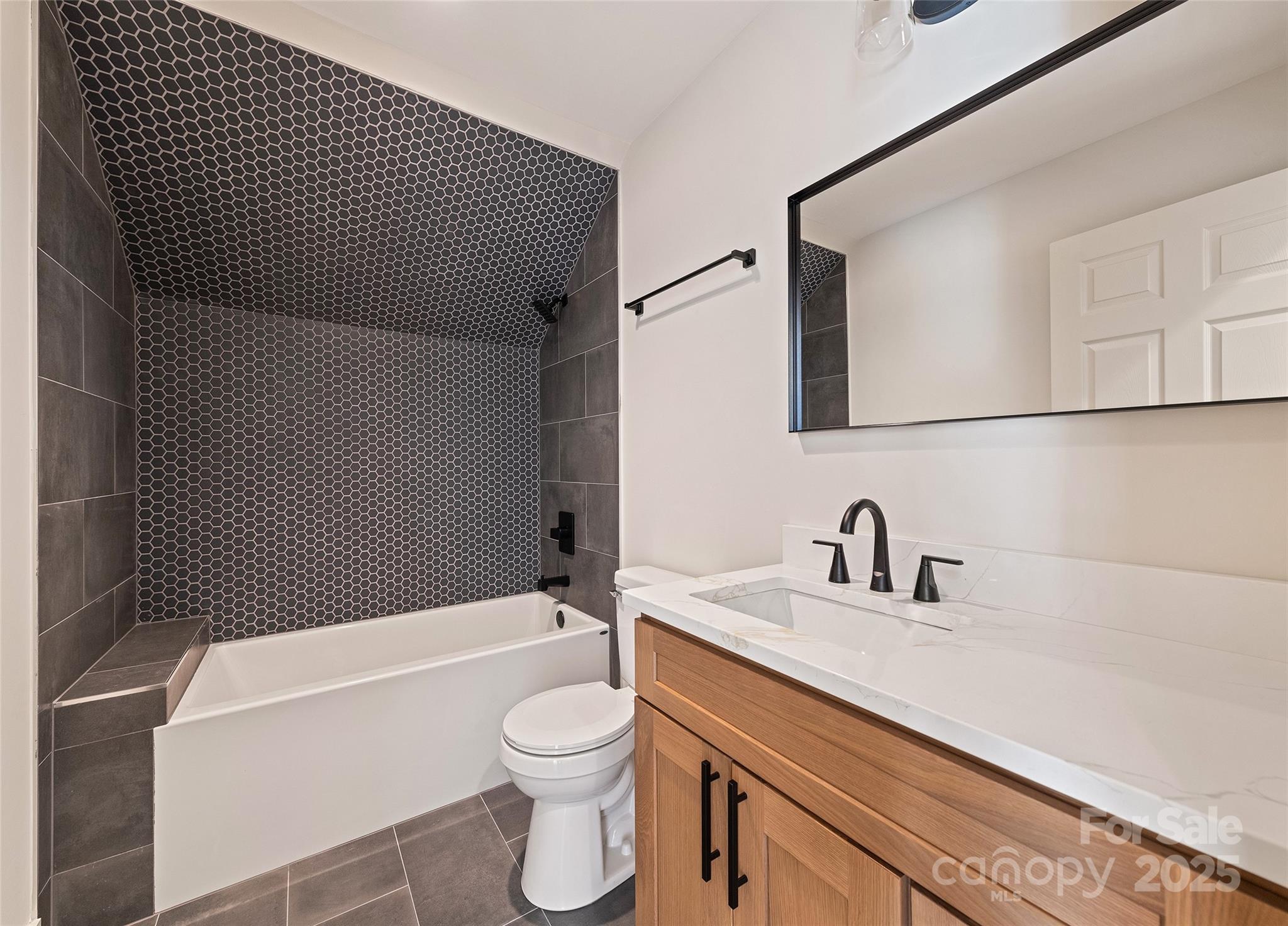 40 Firefly Ridge Trail Alexander, NC 28701 - Photo 27 of 33 a bathroom with a sink toilet and shower