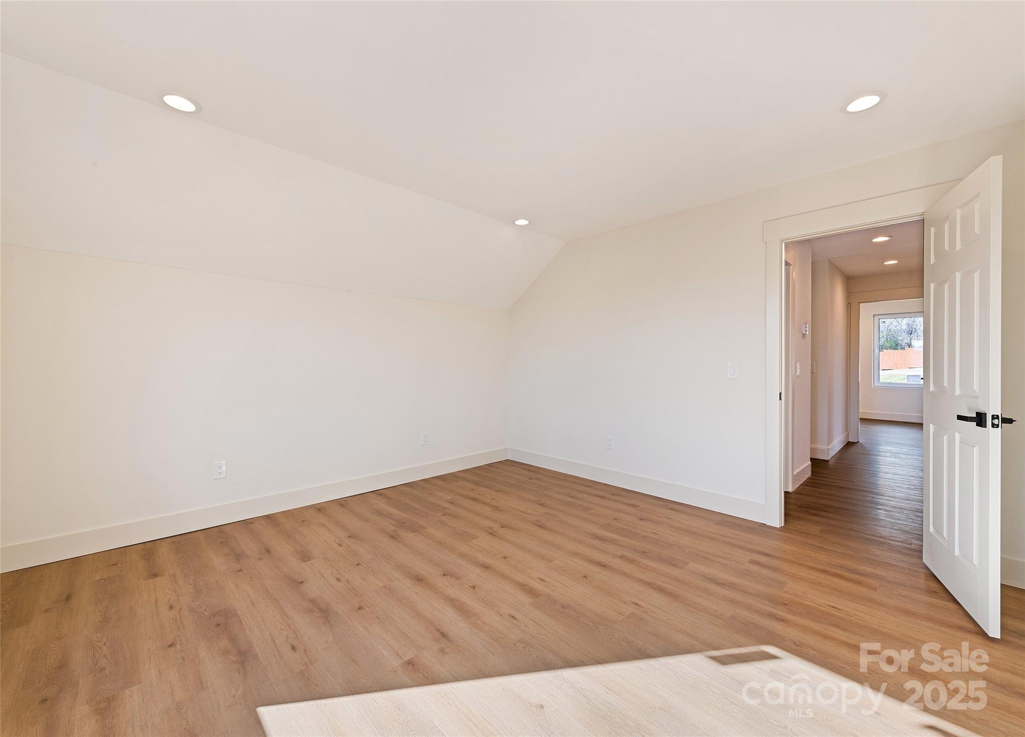40 Firefly Ridge Trail Alexander, NC 28701 - Photo 29 of 33 a view of an empty room with wooden floor and closet