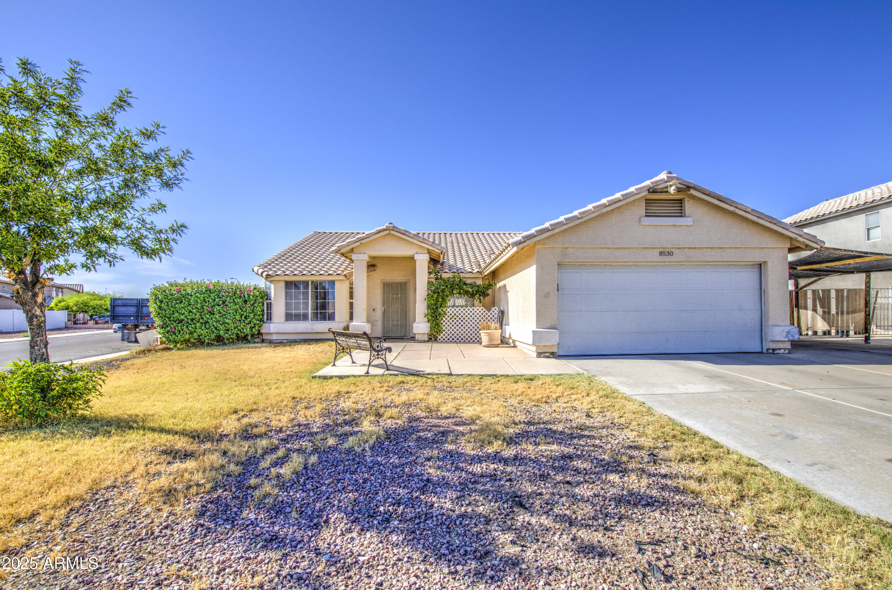 a front view of a house with a yard