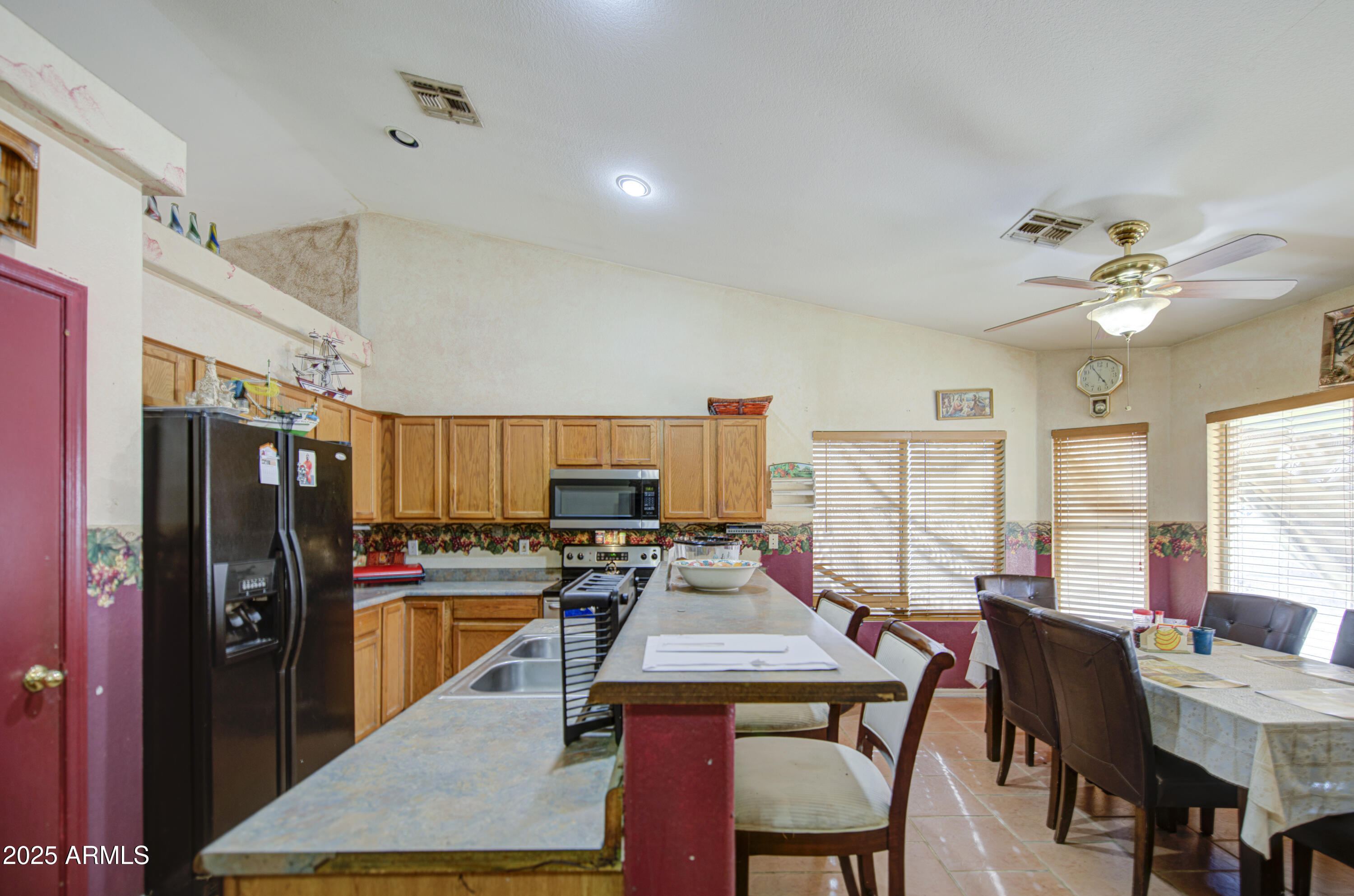 8530 West Berkeley Road Phoenix, AZ 85037 - Photo 15 of 48 a view of a dining room with furniture