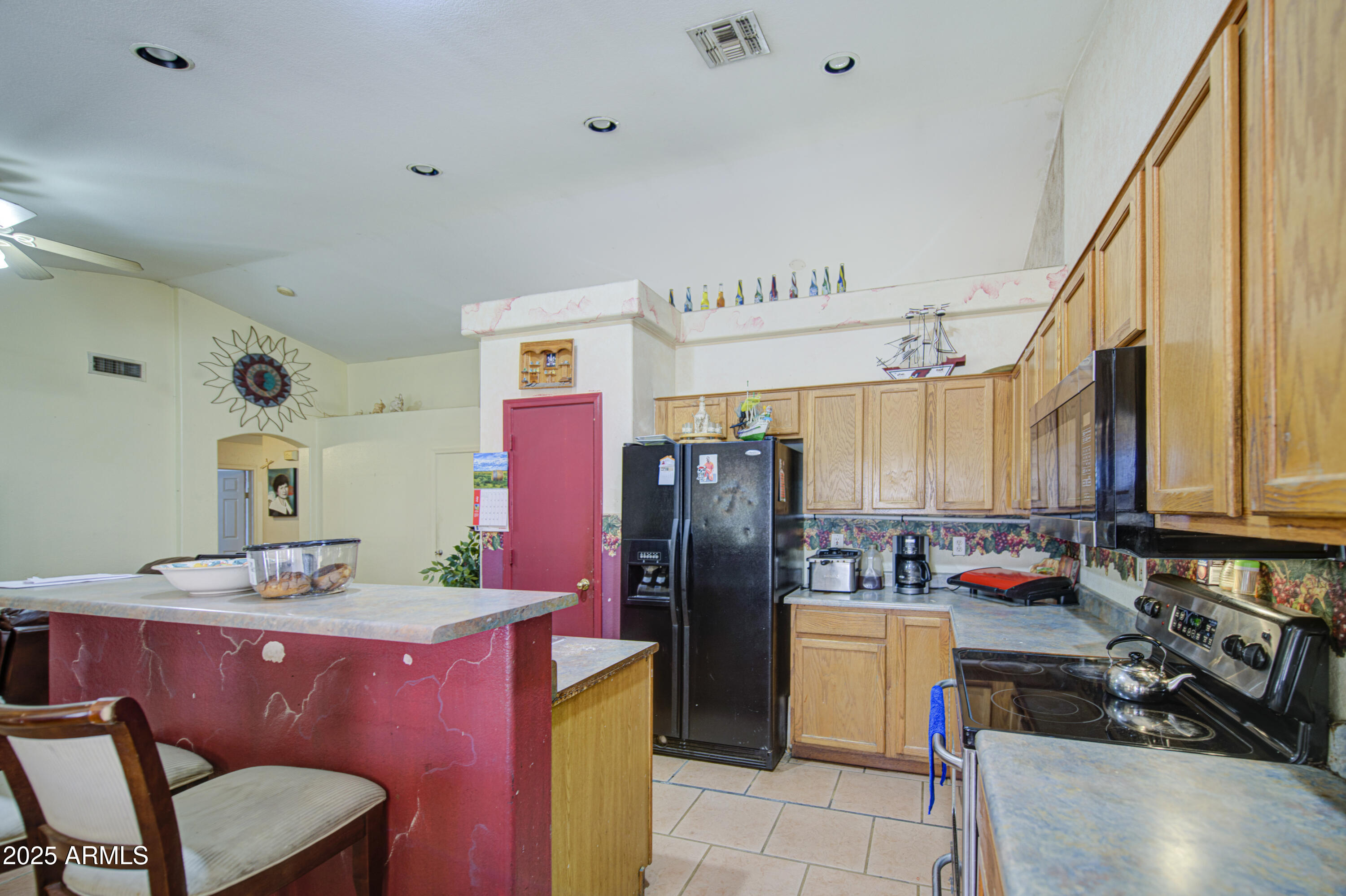 8530 West Berkeley Road Phoenix, AZ 85037 - Photo 20 of 48 a kitchen with granite countertop a refrigerator stove and sink