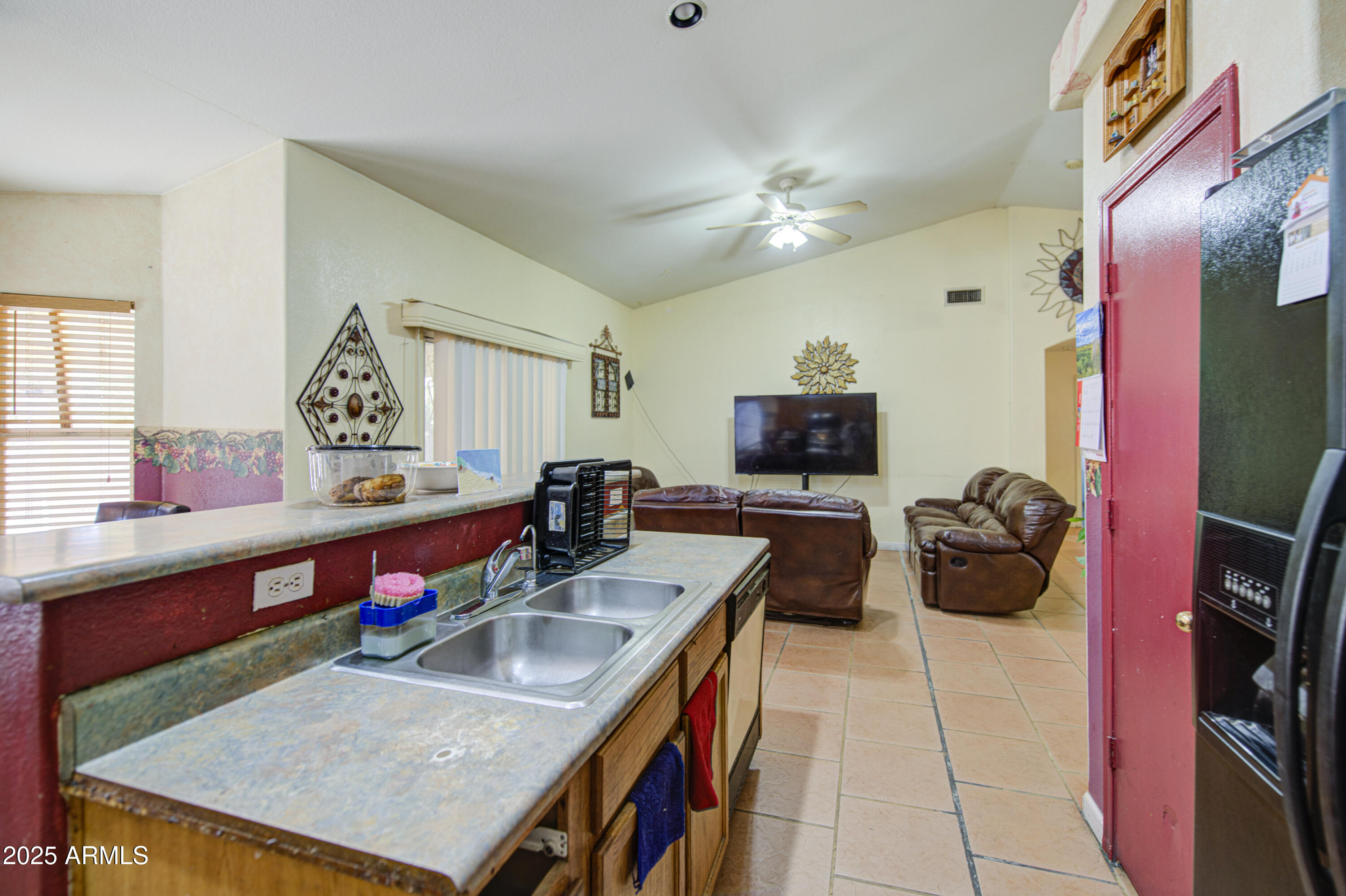 8530 West Berkeley Road Phoenix, AZ 85037 - Photo 23 of 48 a kitchen with stainless steel appliances granite countertop a sink a stove top oven a counter space and cabinets