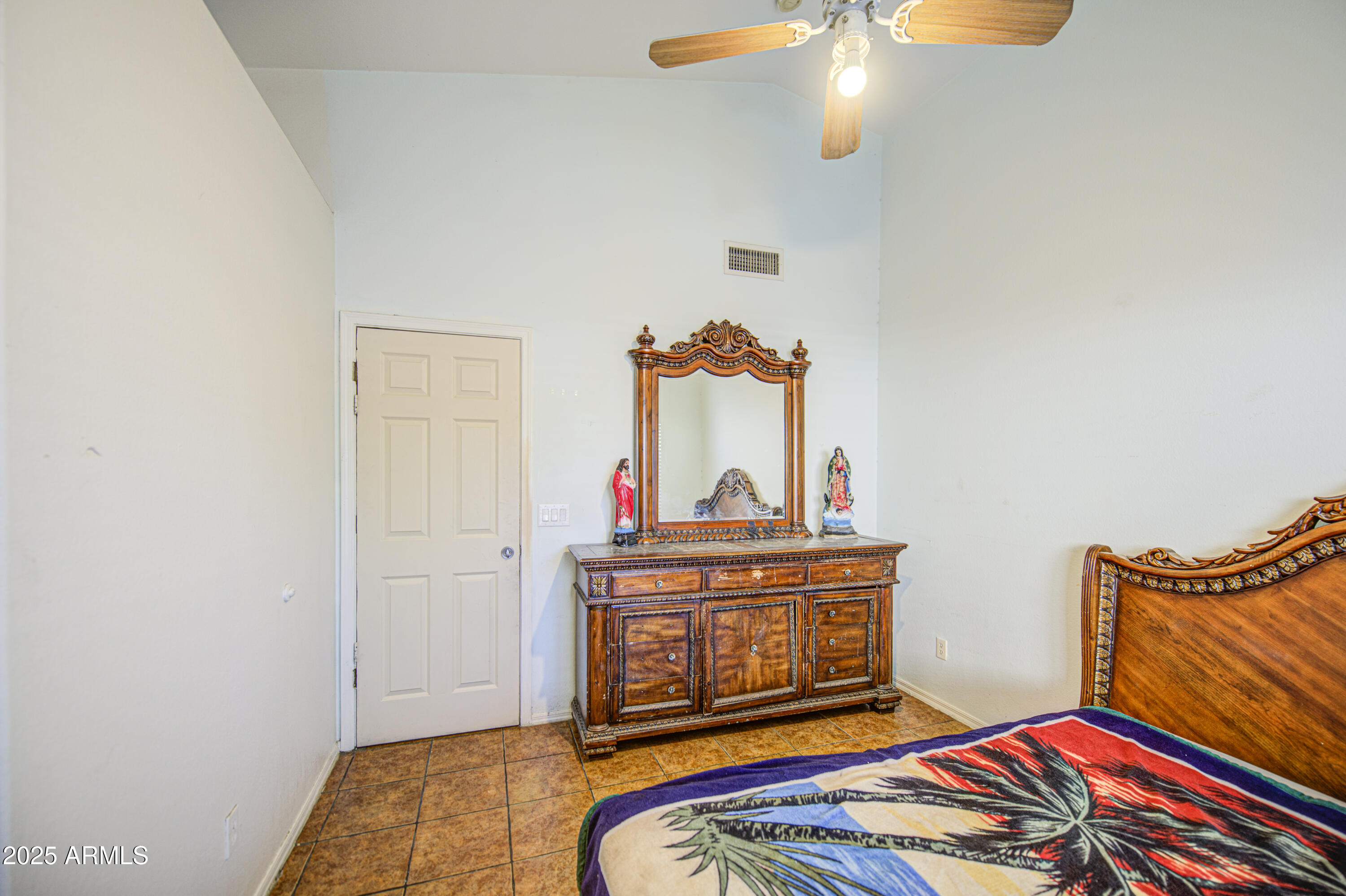 8530 West Berkeley Road Phoenix, AZ 85037 - Photo 32 of 48 a bedroom with bed and wooden floor