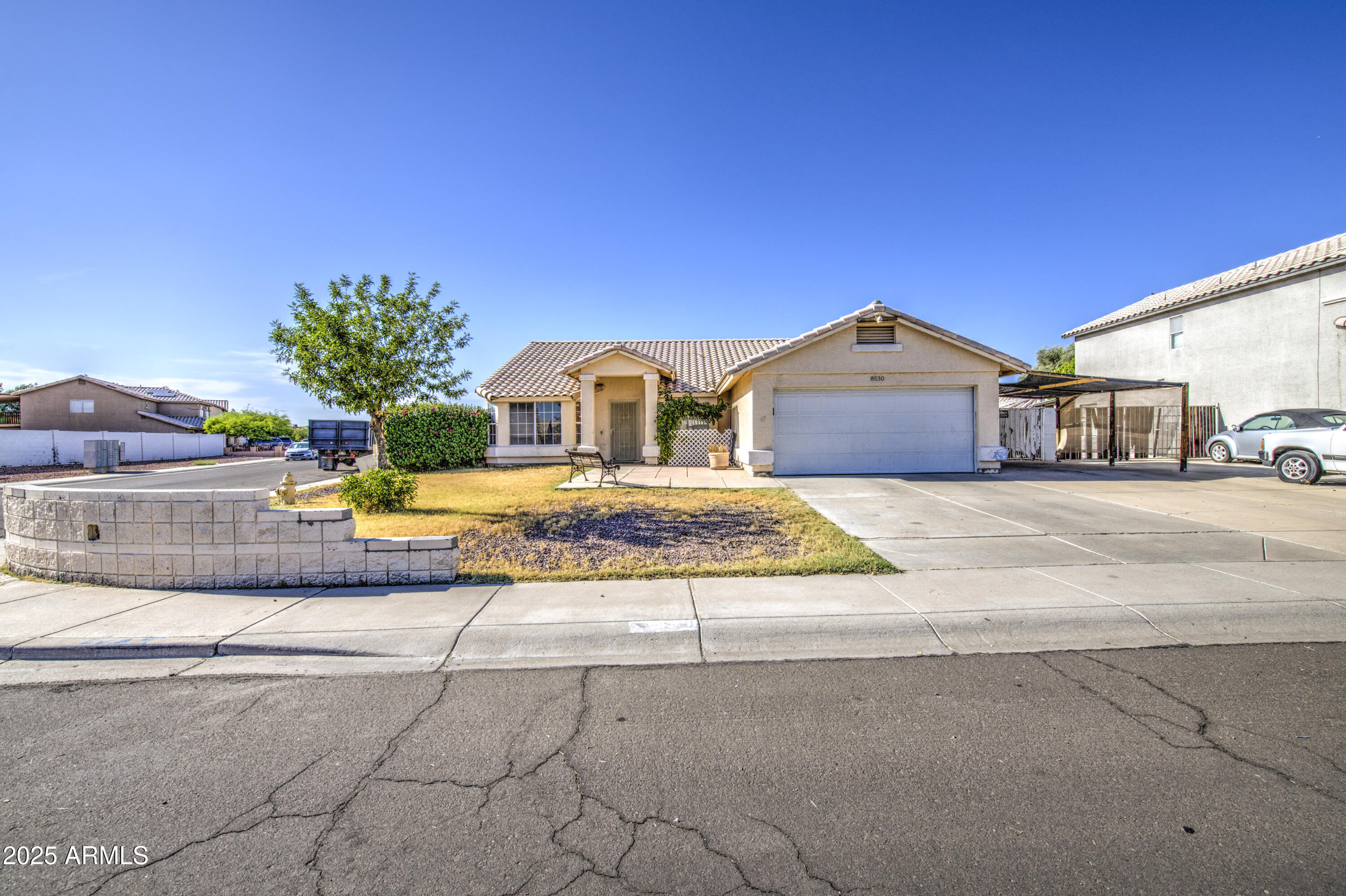 8530 West Berkeley Road Phoenix, AZ 85037 - Photo 4 of 48 a view of a street with houses