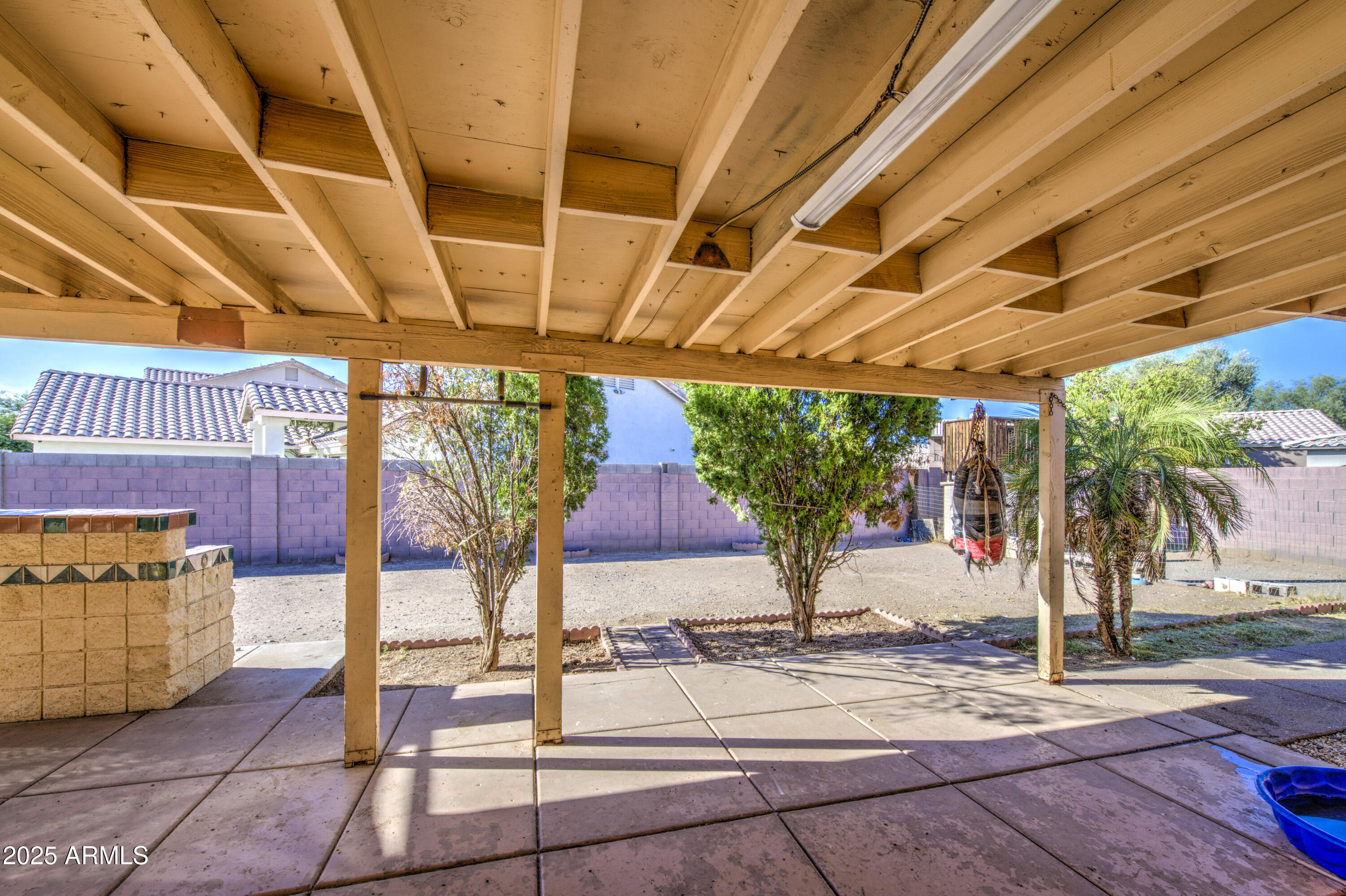 8530 West Berkeley Road Phoenix, AZ 85037 - Photo 41 of 48 a view of a patio with table and chairs potted plants