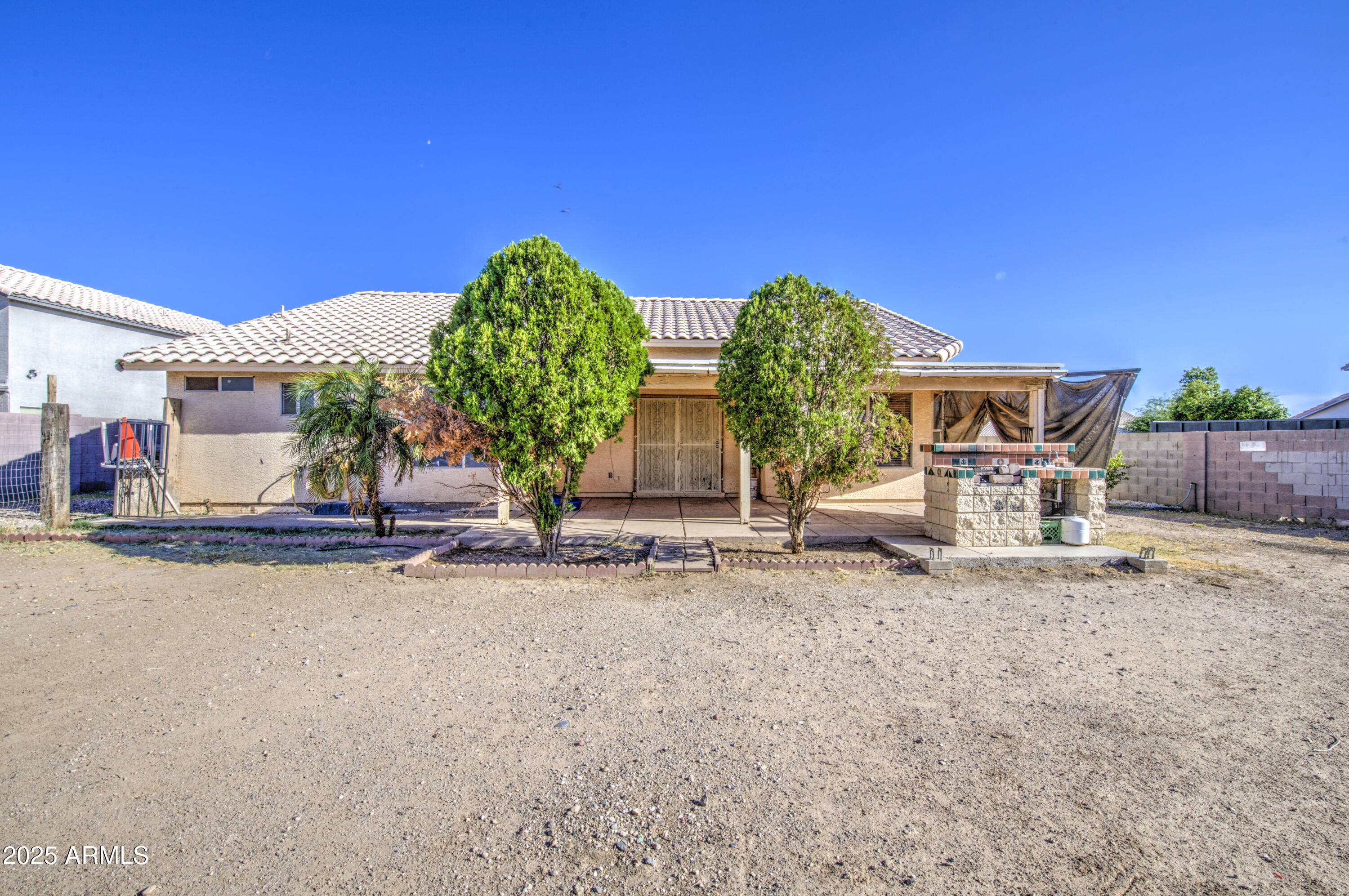 8530 West Berkeley Road Phoenix, AZ 85037 - Photo 45 of 48 a front view of a house with garden