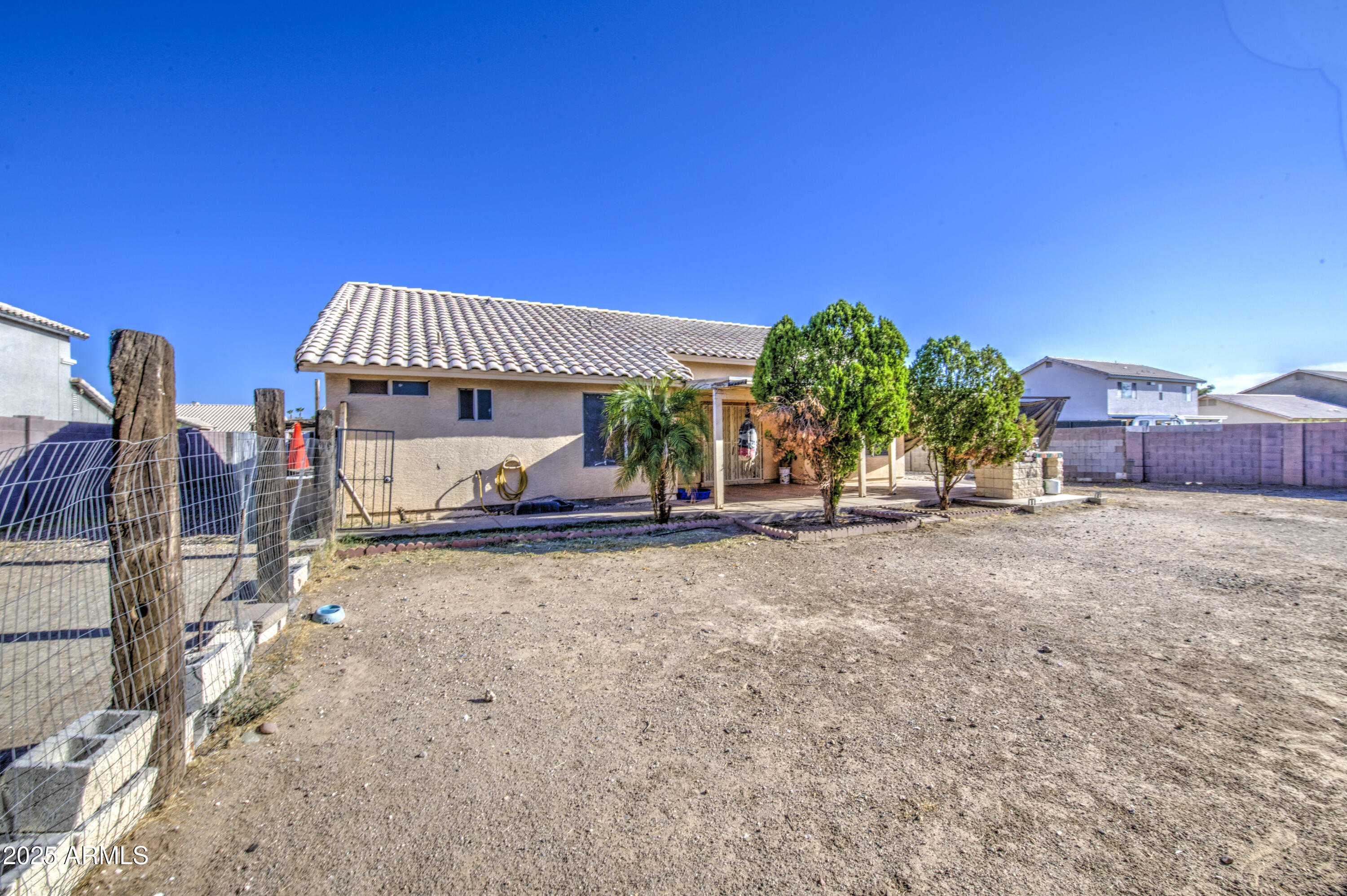 8530 West Berkeley Road Phoenix, AZ 85037 - Photo 46 of 48 a view of a house with a yard