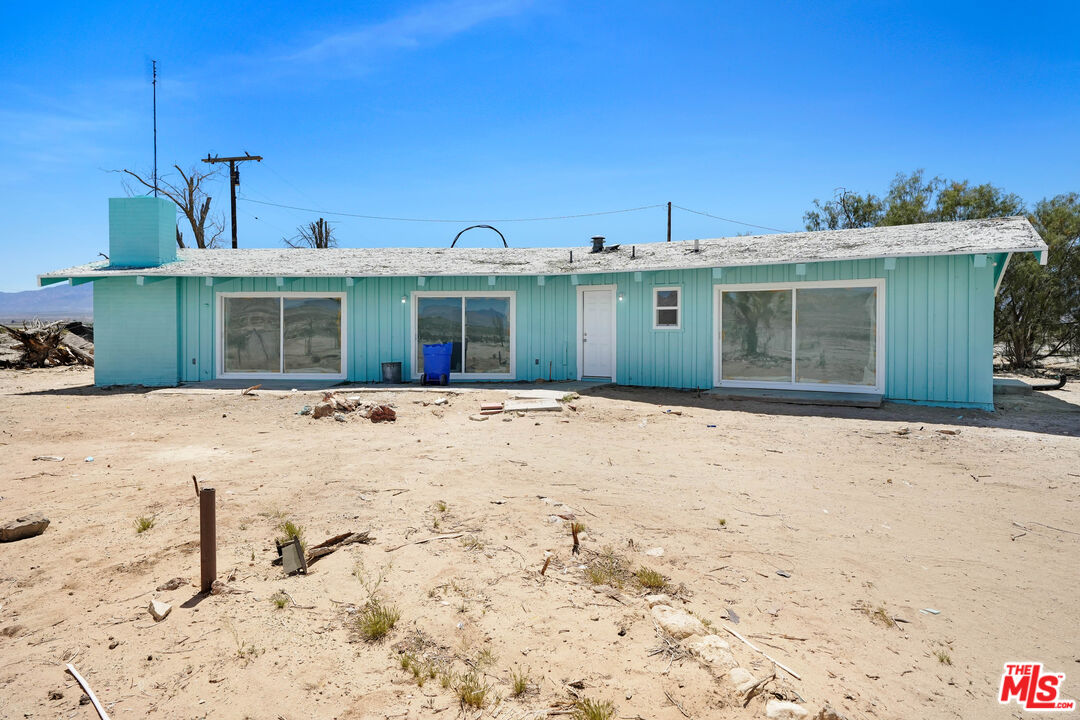 37170 Rabbit Springs Road Lucerne Valley, CA 92356 - Photo 1 of 10 a front view of a house with a yard