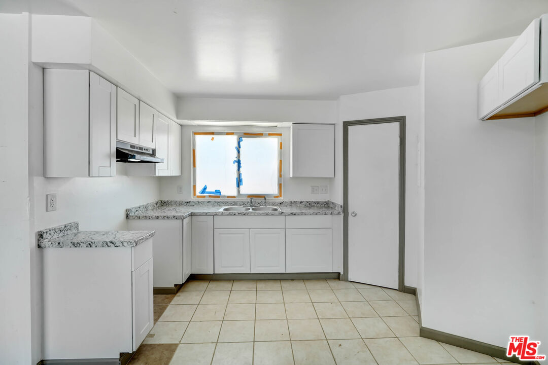 37170 Rabbit Springs Road Lucerne Valley, CA 92356 - Photo 5 of 10 a kitchen with stainless steel appliances granite countertop a sink and a stove