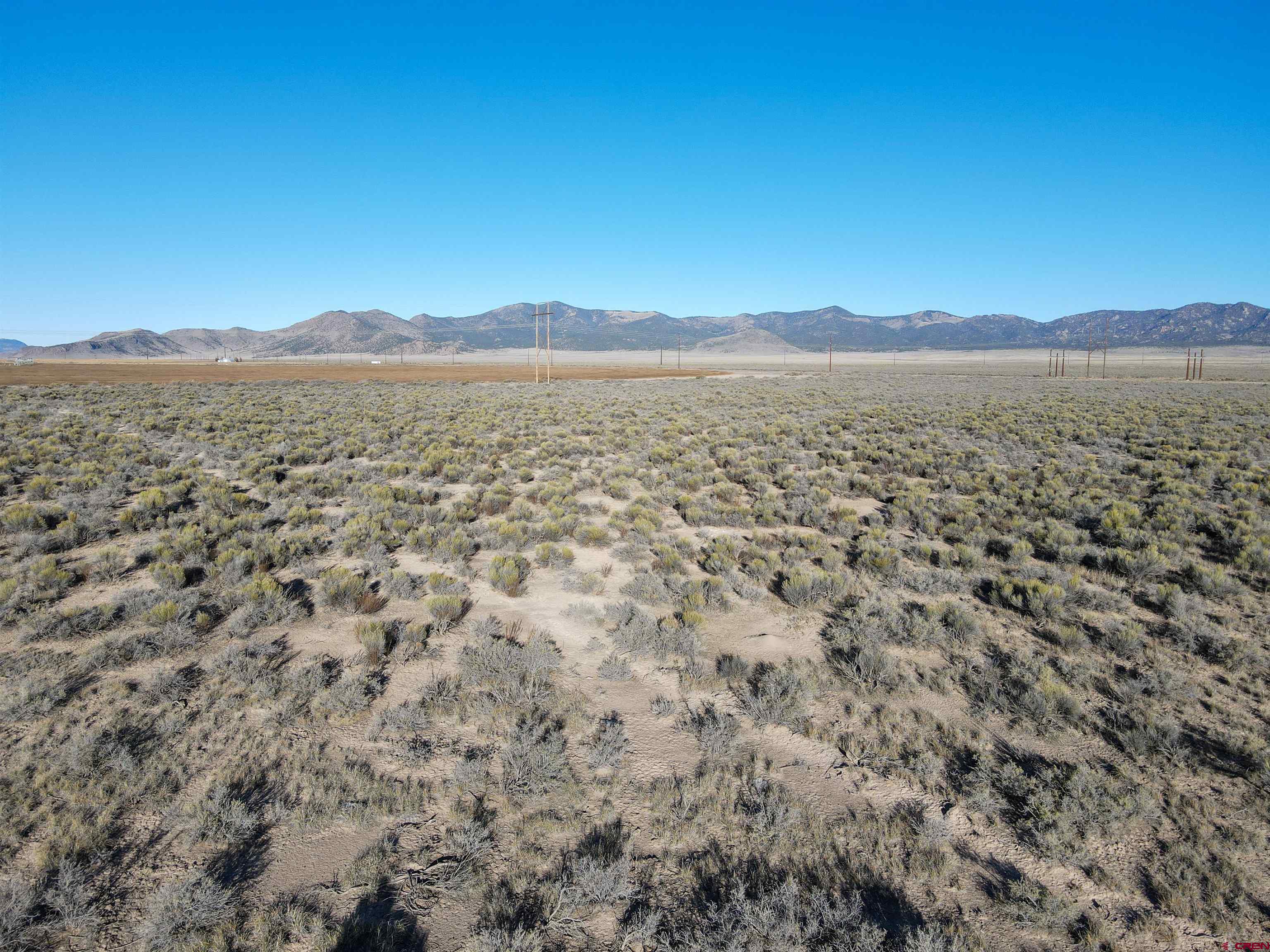 55750 Aa Road Moffat, CO 81143 - Photo 7 of 29 a view of a large body of water with a building in the background