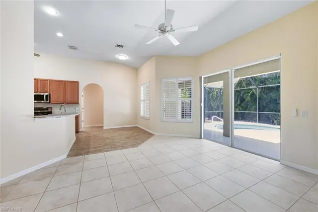 a view of livingroom with furniture and ceiling fan