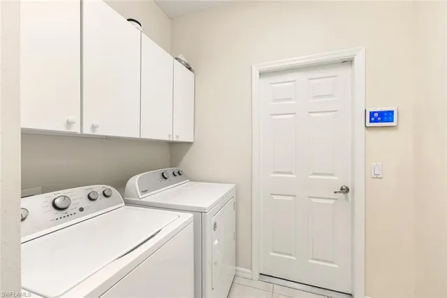 a view of storage and utility room with washer and dryer