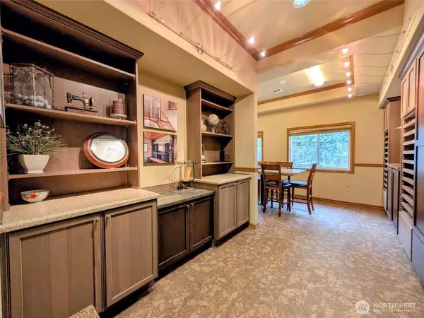 a kitchen with stainless steel appliances granite countertop a sink and cabinets