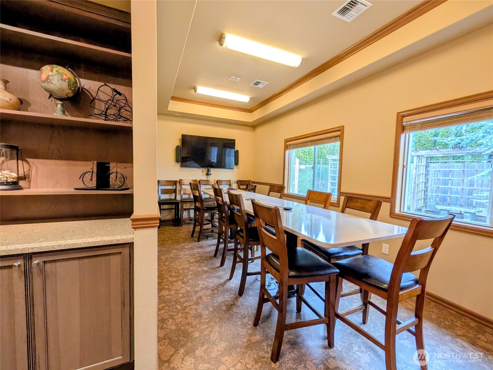 259003 Highway 101, Unit B Sequim, WA 98382 - Photo 14 of 21 a view of a dining room with furniture and a kitchen