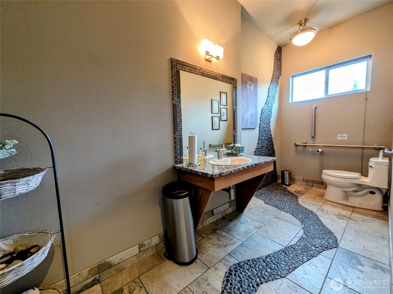 259003 Highway 101, Unit B Sequim, WA 98382 - Photo 16 of 21 a bathroom with a sink and a mirror