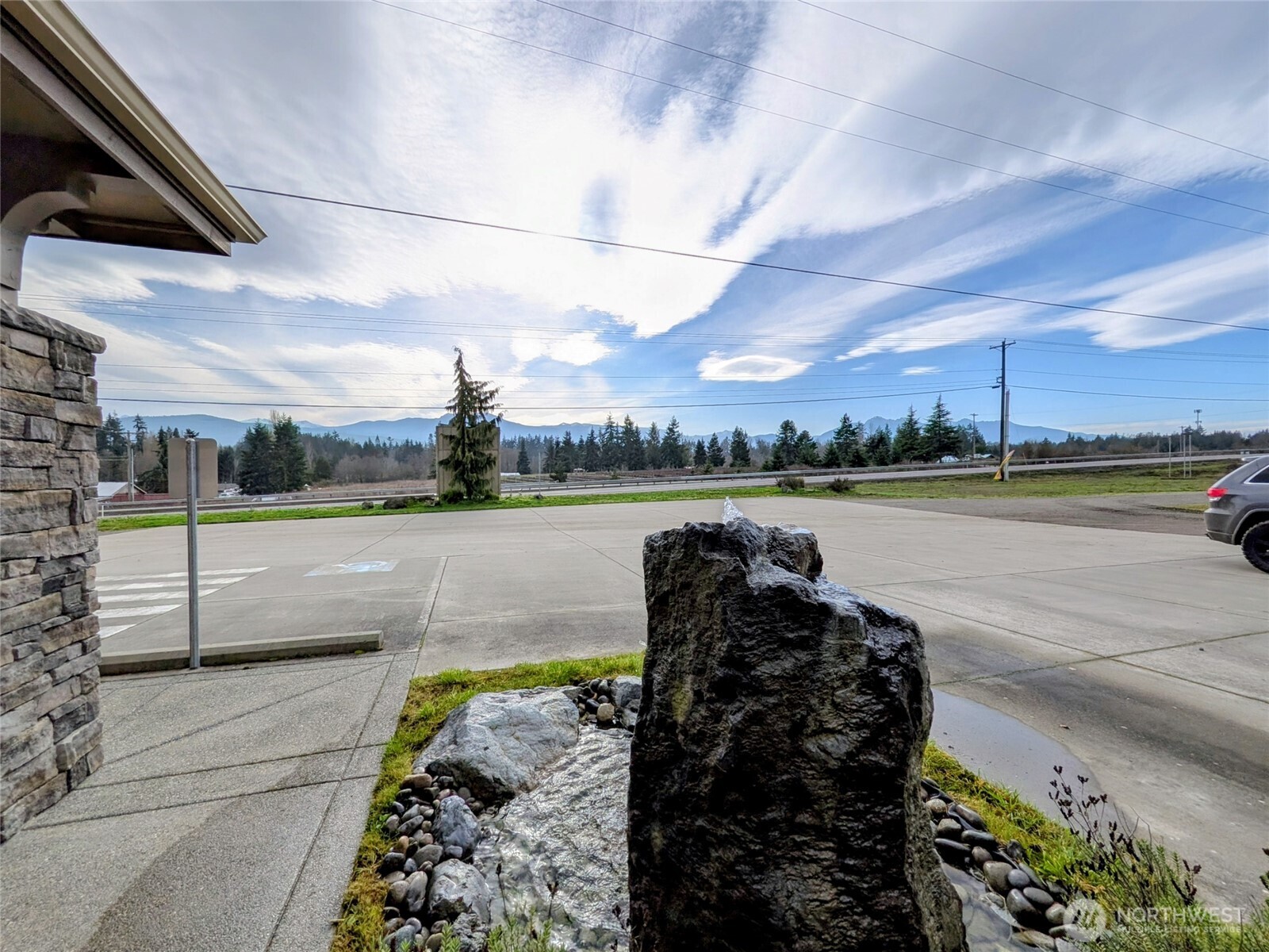 259003 Highway 101, Unit B Sequim, WA 98382 - Photo 17 of 21 a view of a lake with a outdoor space