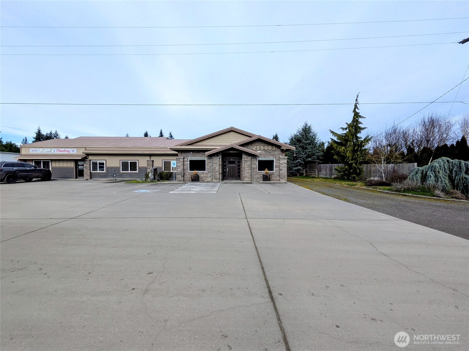 259003 Highway 101, Unit B Sequim, WA 98382 - Photo 18 of 21 a view of a house with a yard and sitting area