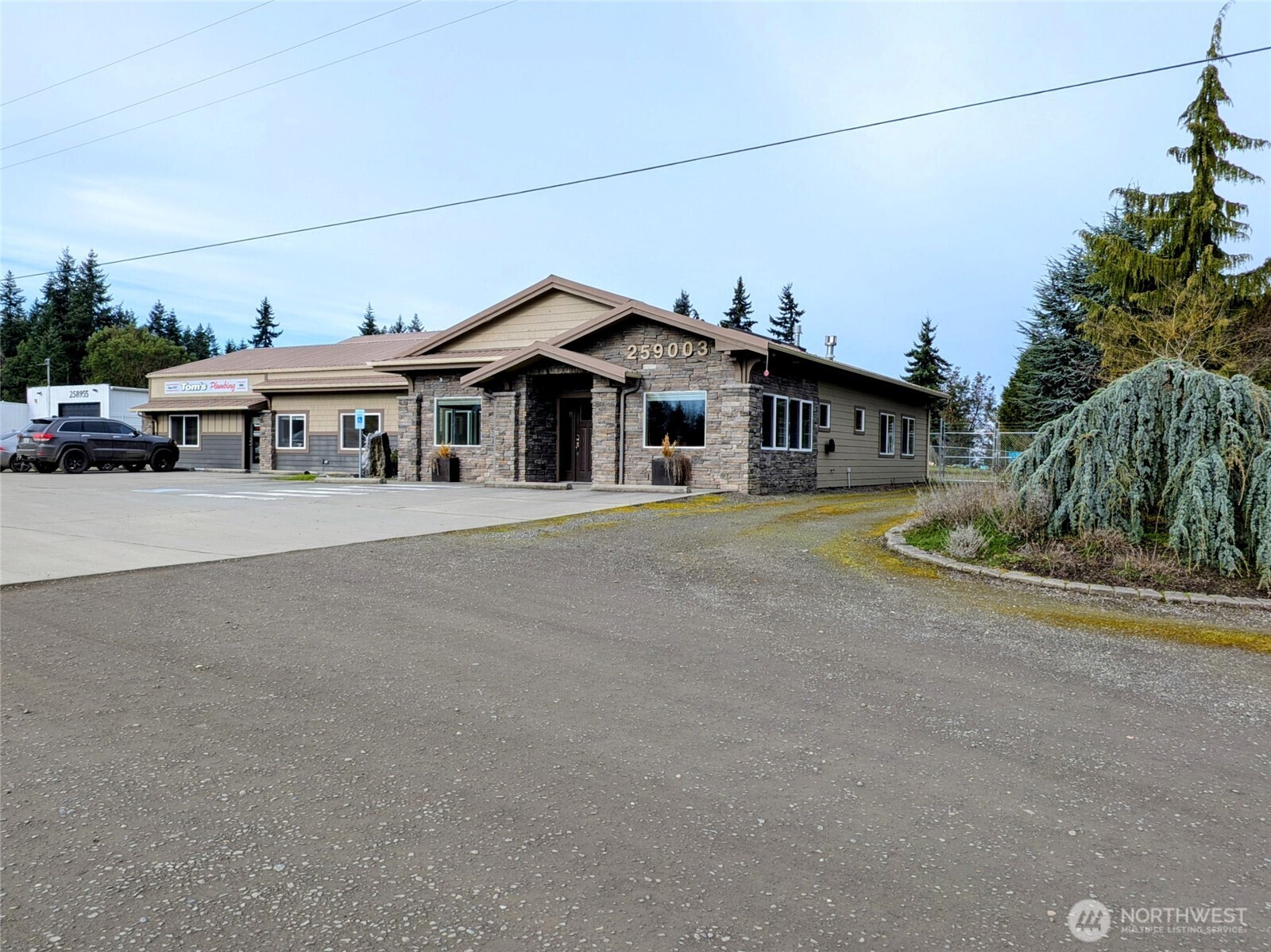 259003 Highway 101, Unit B Sequim, WA 98382 - Photo 19 of 21 a front view of a house with a yard