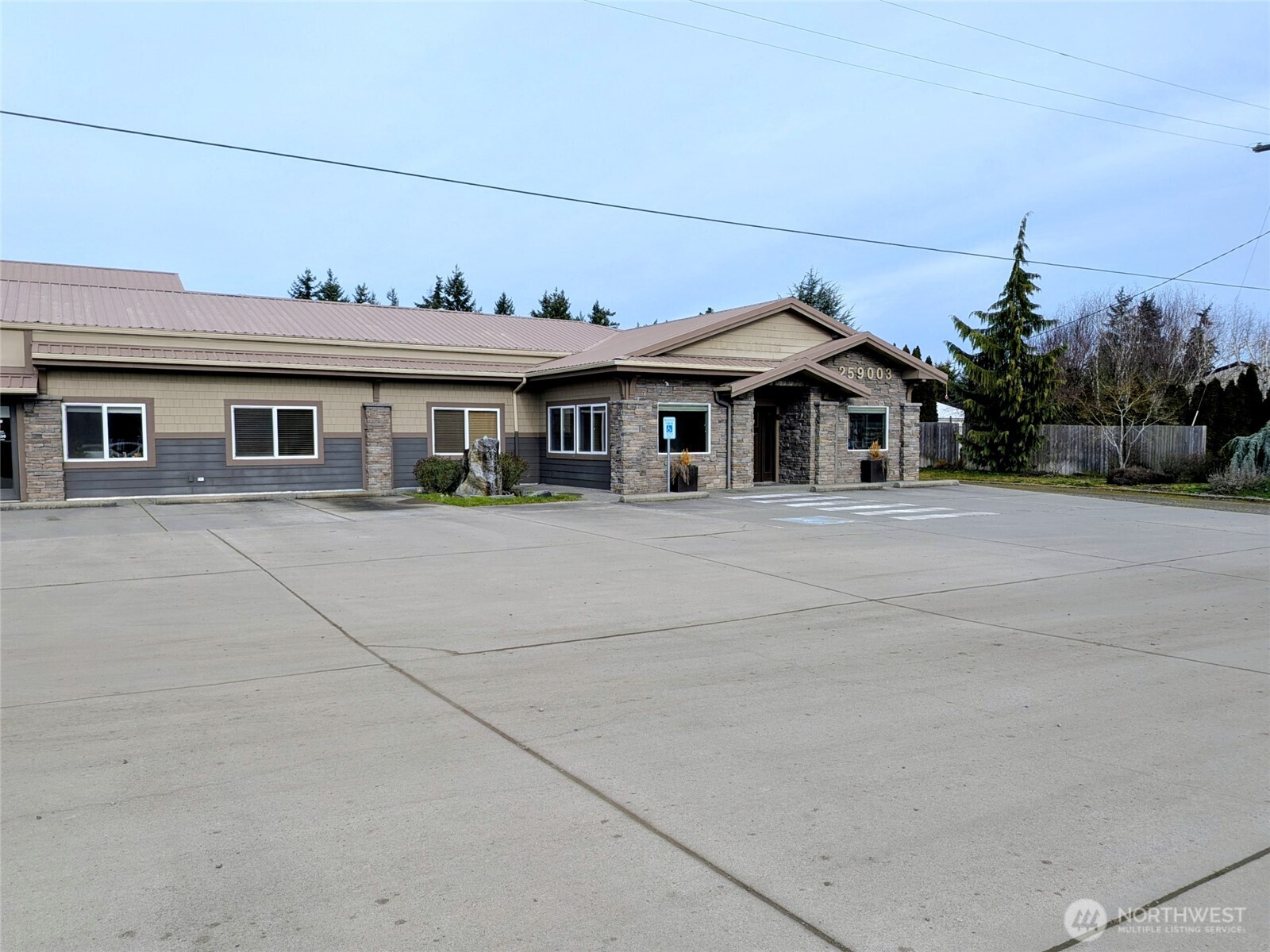 259003 Highway 101, Unit B Sequim, WA 98382 - Photo 20 of 21 a front view of a house with a yard