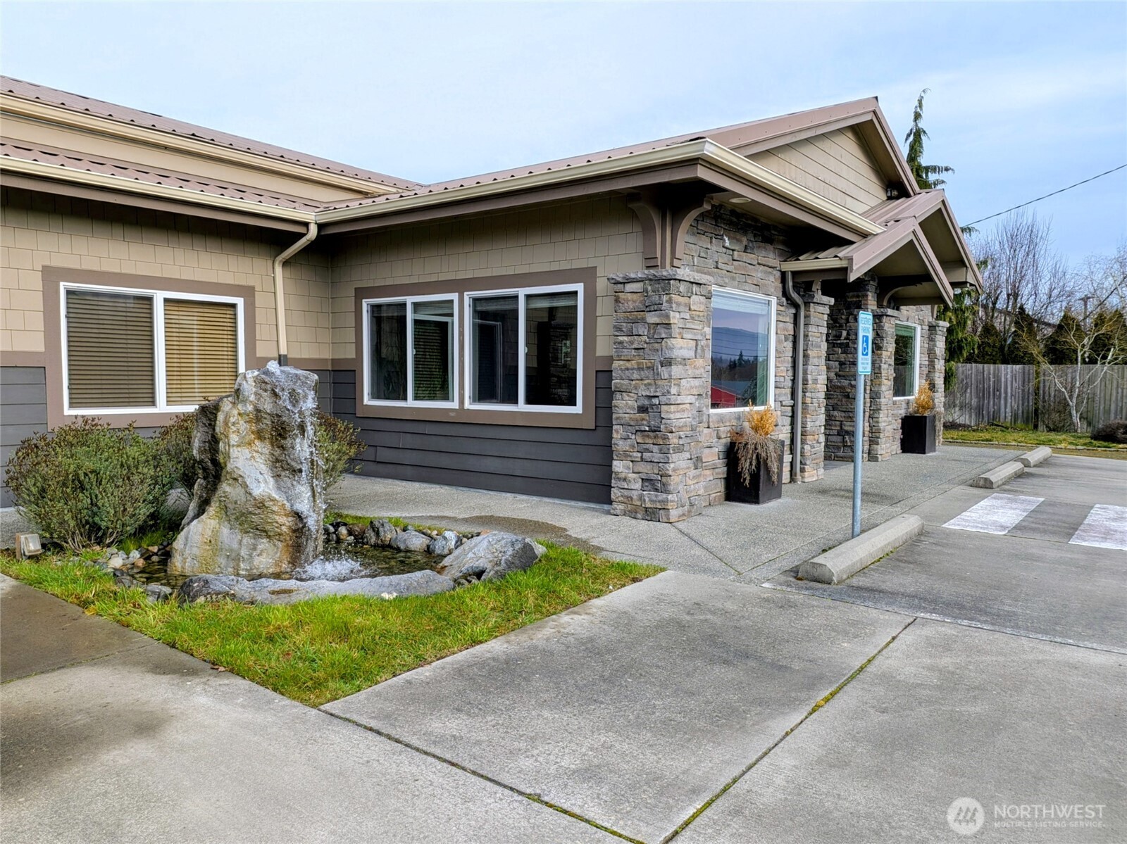 259003 Highway 101, Unit B Sequim, WA 98382 - Photo 2 of 21 a front view of a house with garden