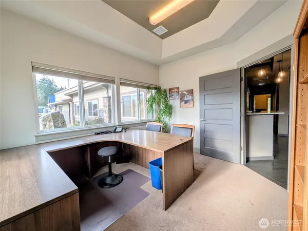 a dining room with a large window and table
