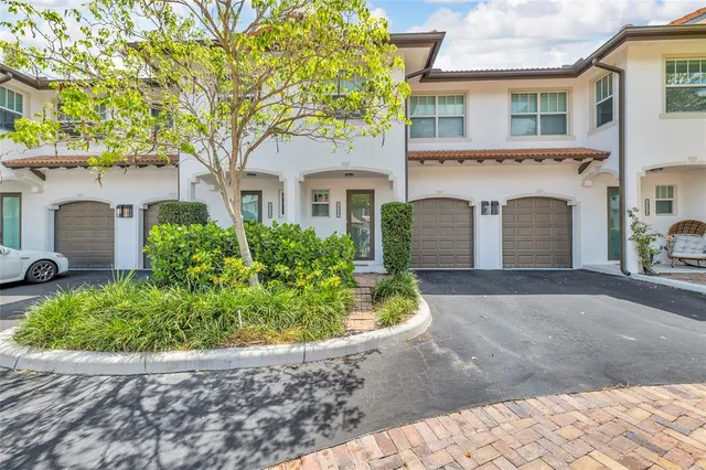 front view of a house with a garden