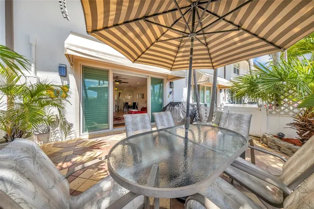 a view of patio with swimming pool and porch with furniture