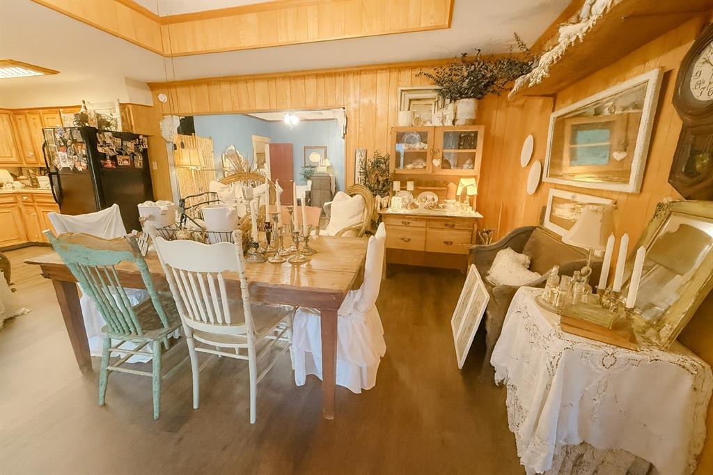 314 Cockerell Street Eustace, TX 75124 - Photo 12 of 15 a dining room with furniture and a chandelier