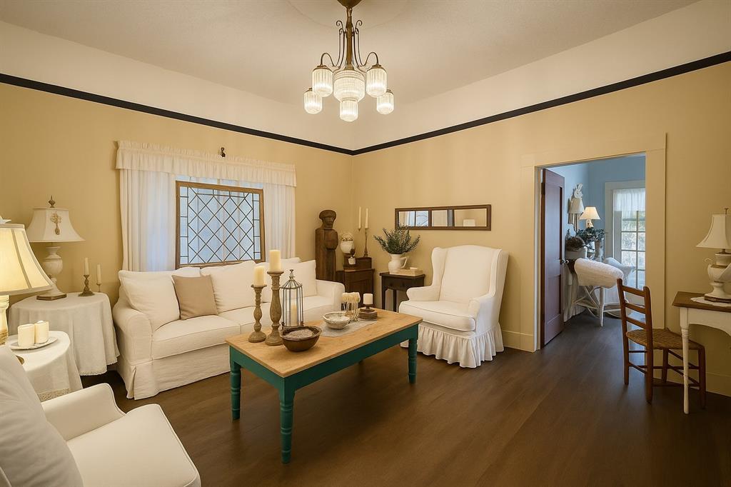 314 Cockerell Street Eustace, TX 75124 - Photo 3 of 15 a living room with furniture and a chandelier