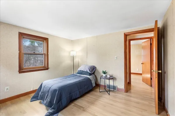 a bedroom with a bed and a view of bathroom