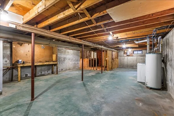a view of water heater room with wooden ceiling