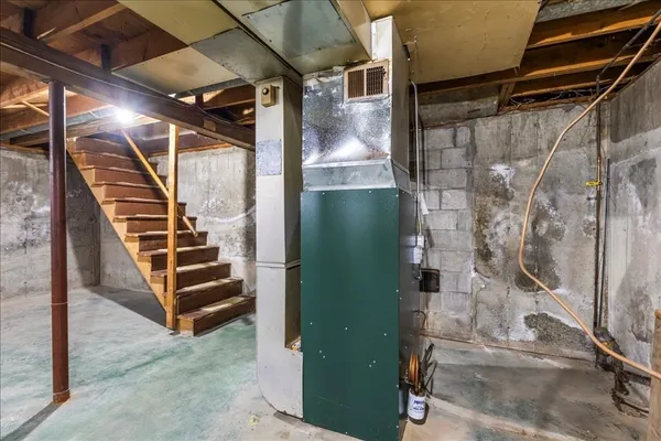 a view of a room with stairs and windows