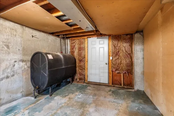 a room with a wooden floor and furniture