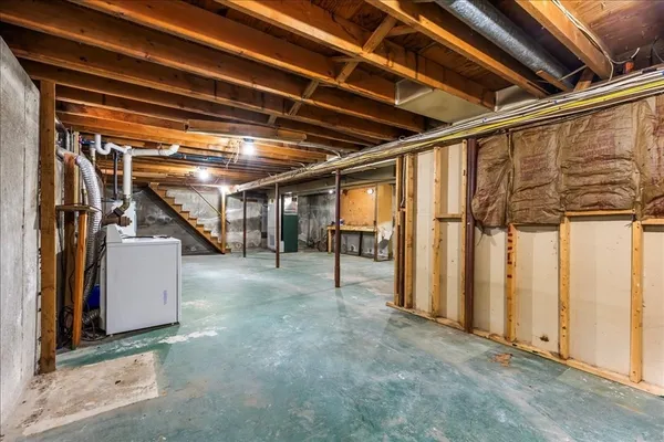 a view of an empty room with stairs
