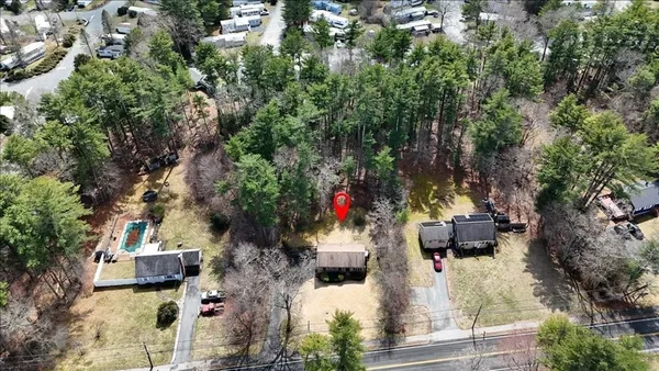 an aerial view of residential houses with outdoor space